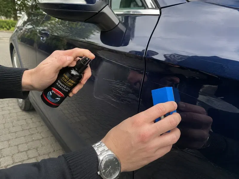 Visible paint damage and oxidation on a vehicle surface before applying NuraFix scratch repair solution.