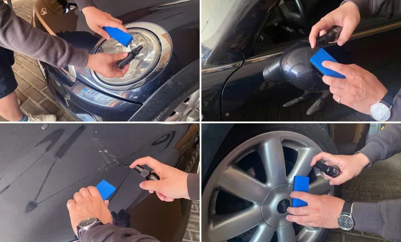 Main appliquant une petite quantité de spray sur l'aile d'une voiture.